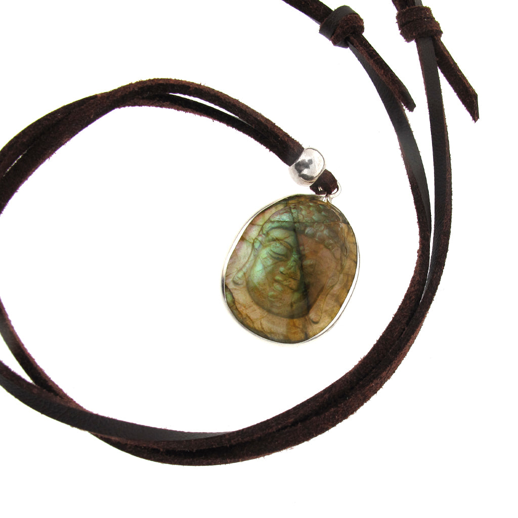 Buddha head pendant carved in Labradorite with sterling silver mount, on brown faux suede cord