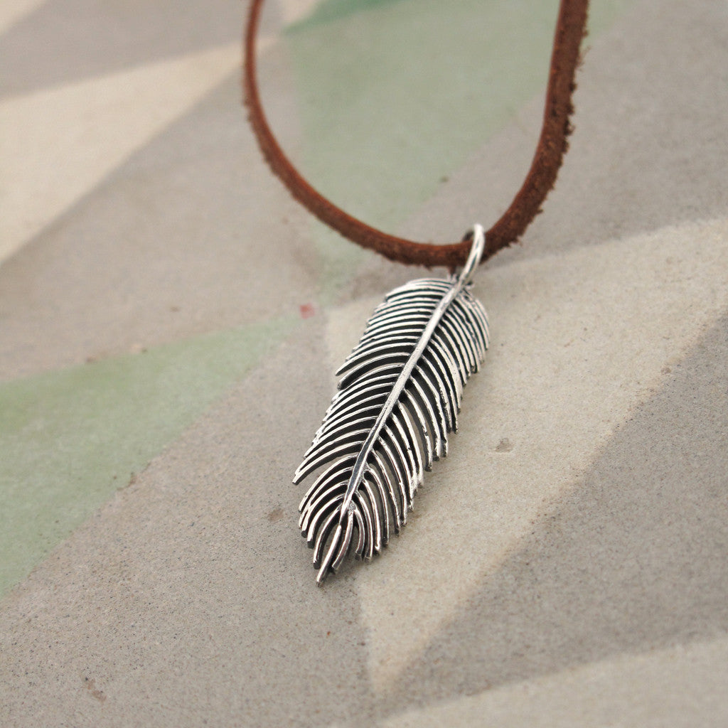 Feather sterling silver pendant on leather necklace, handstiched neck