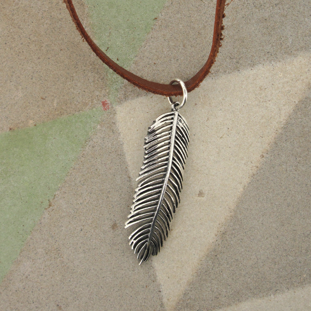 Feather sterling silver pendant on leather necklace, handstiched neck