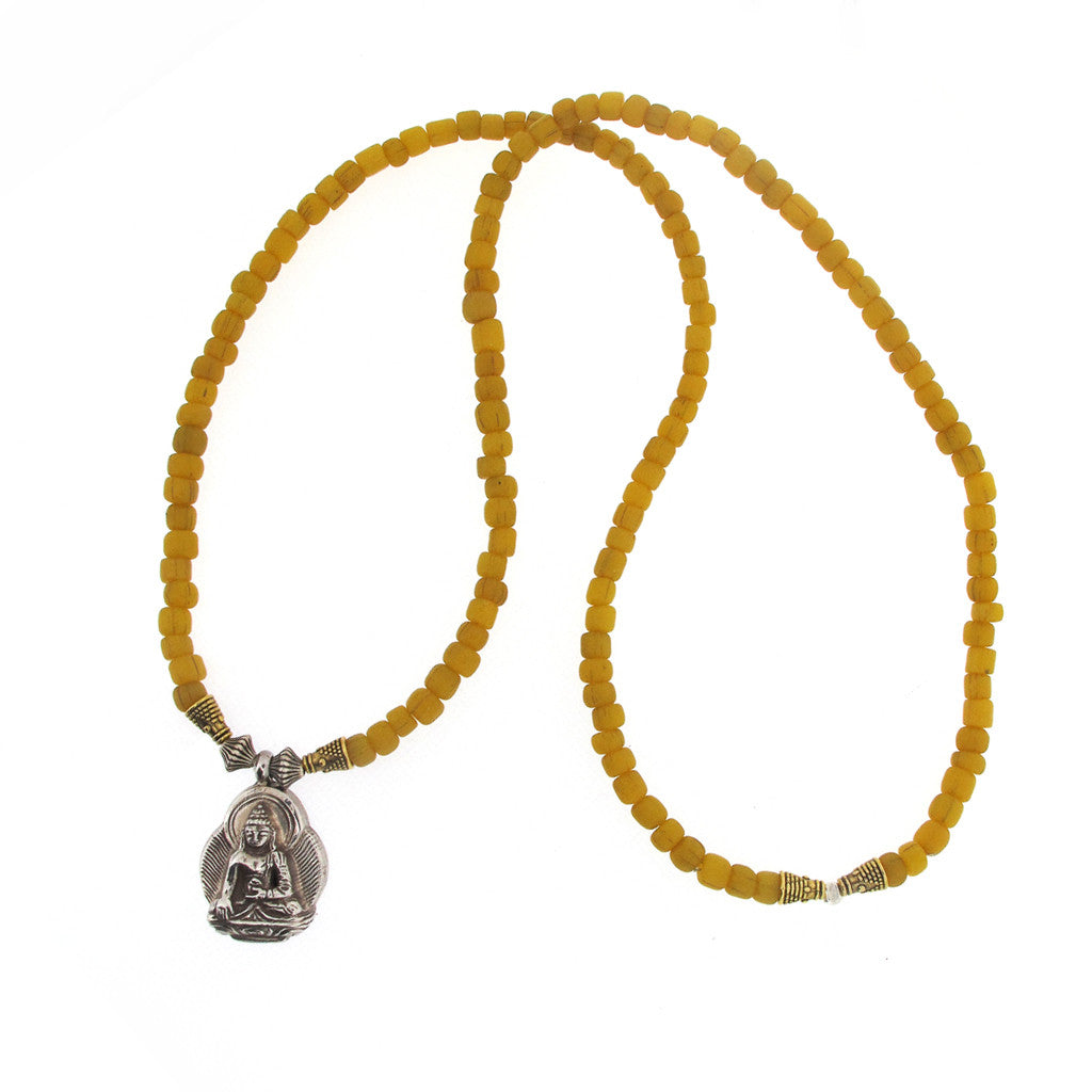 Tibetan seated silver Buddha on glass bead necklace