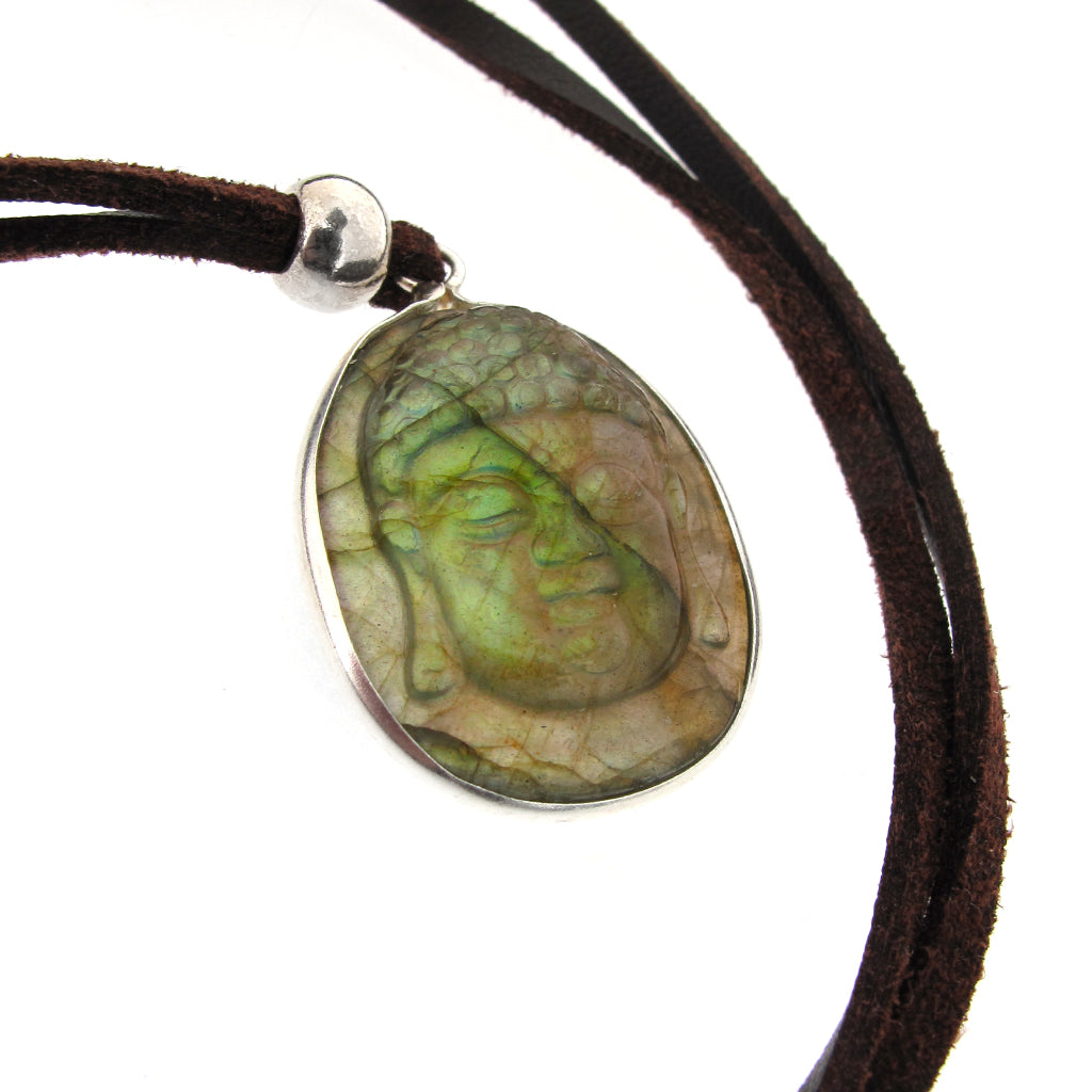 Buddha head pendant carved in Labradorite with sterling silver mount, on brown faux suede cord