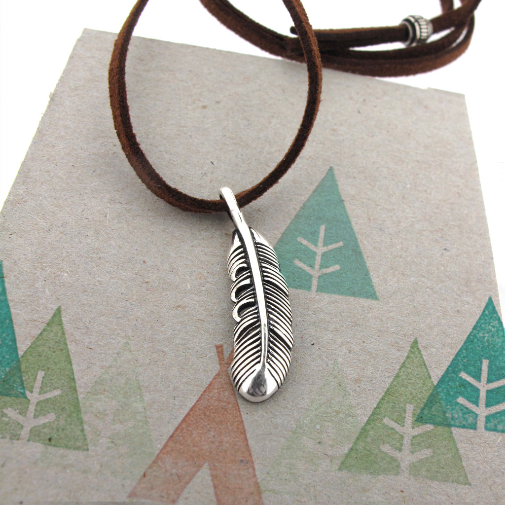 Japanese feather, sterling silver pendant on brown faux suede