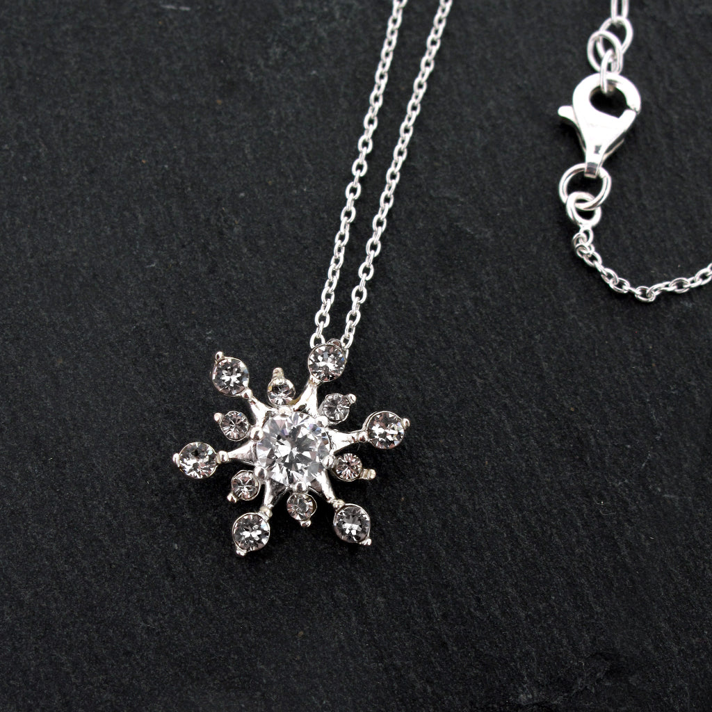 cubic zirconia crystal snow flake pendant on an adjustable sterling silver chain.