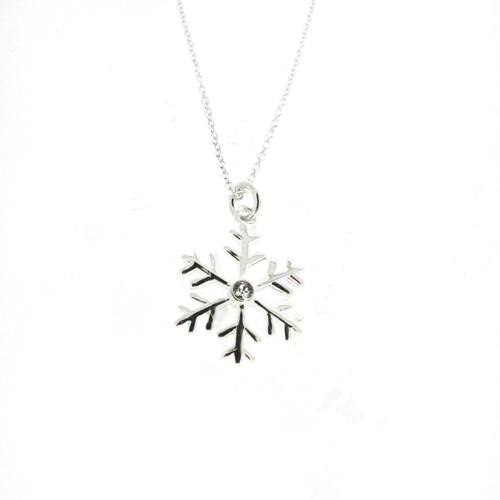 Snow flake sterling silver pendant with CZ center crystal on sterling silver chain