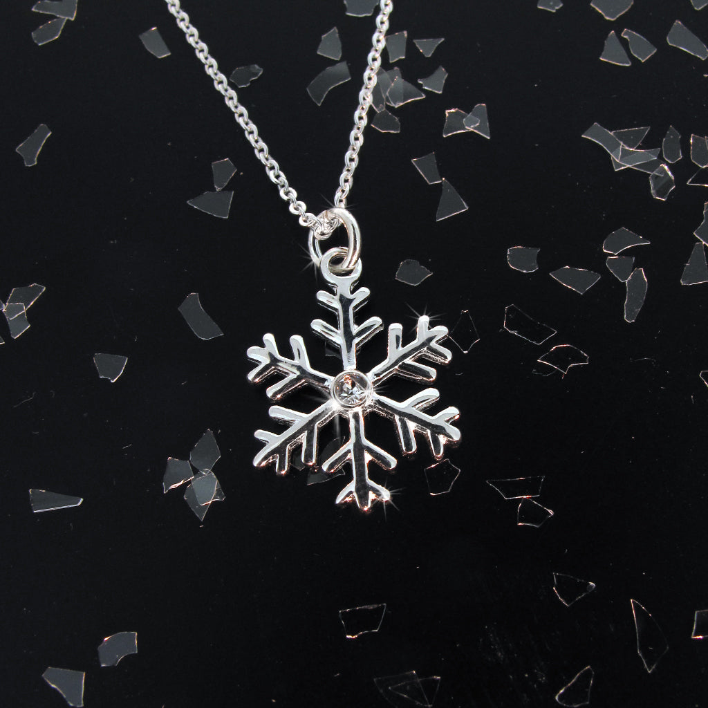 Snow flake sterling silver pendant with CZ center crystal on sterling silver chain