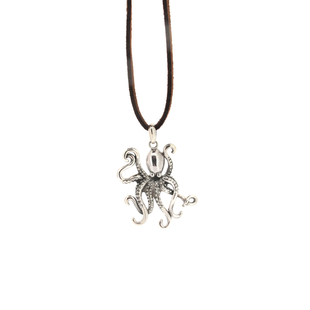 Octopus sterling silver 925 pendant, on brown faux suede