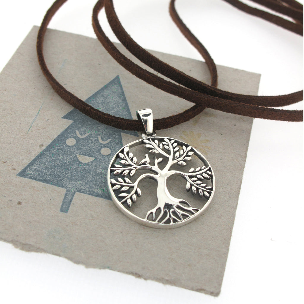 Tree of life sterling silver pendant, on brown faux suede
