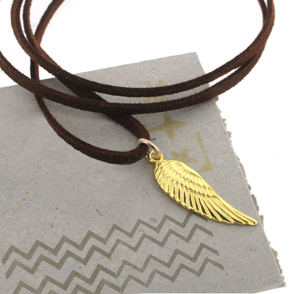 Gold plate and sterling silver wing on brown faux suede